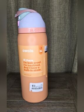Owala Insulated Water Bottle in Peach with Pastel Lid